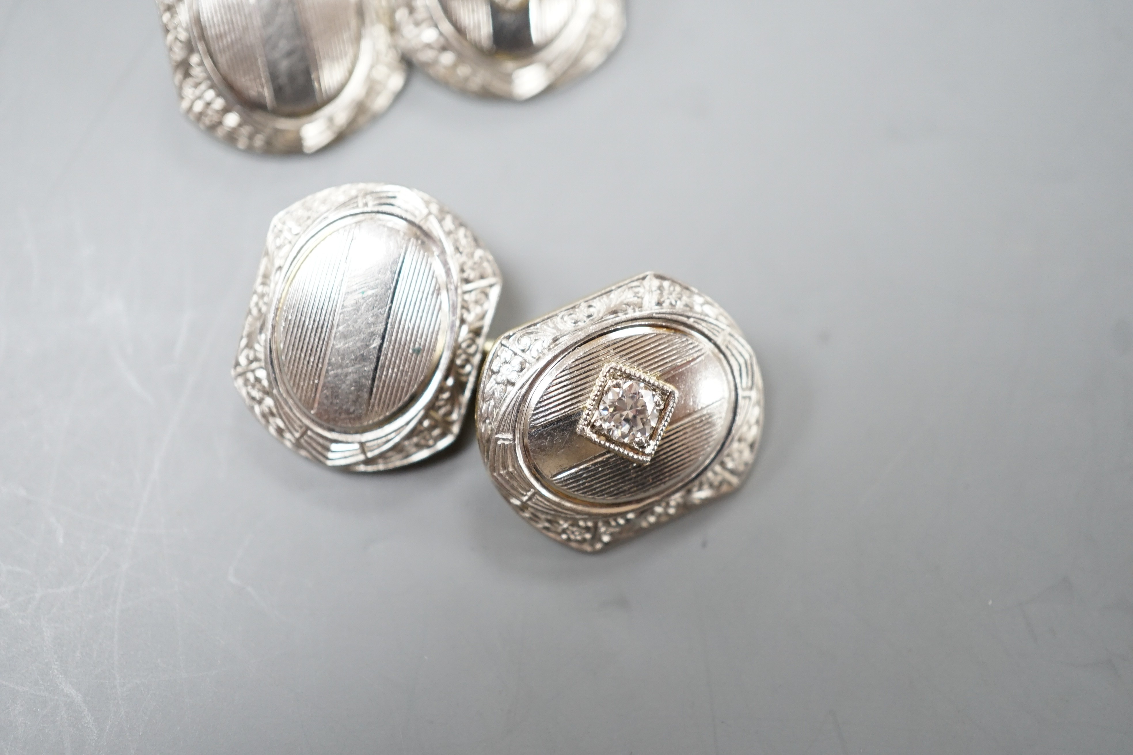 A pair of two colour 14k and diamond set shaped hexagonal cufflinks, 13mm, 9.6 grams.